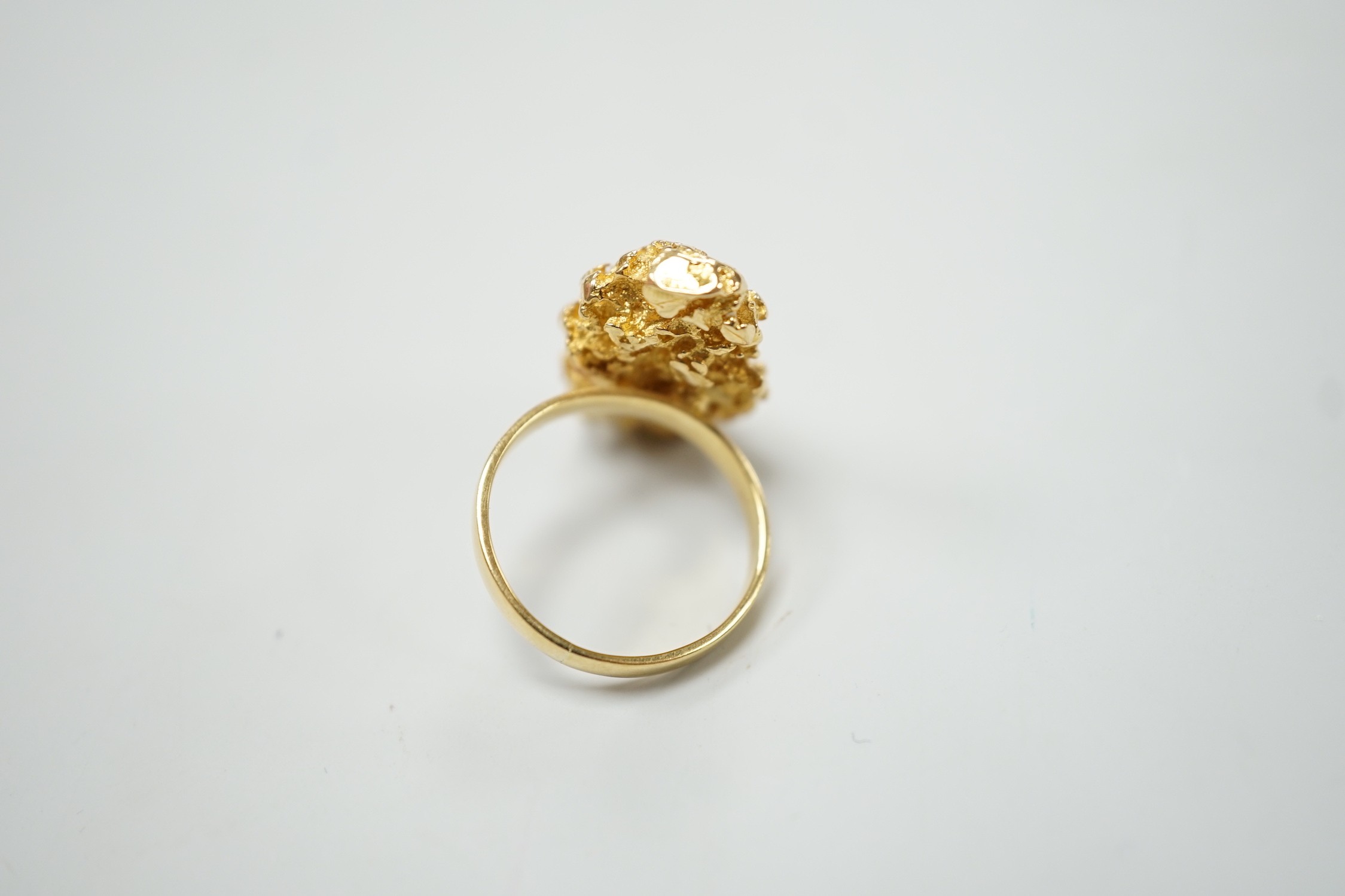 An African yellow metal nugget ring, size M/N, 15.3 grams.